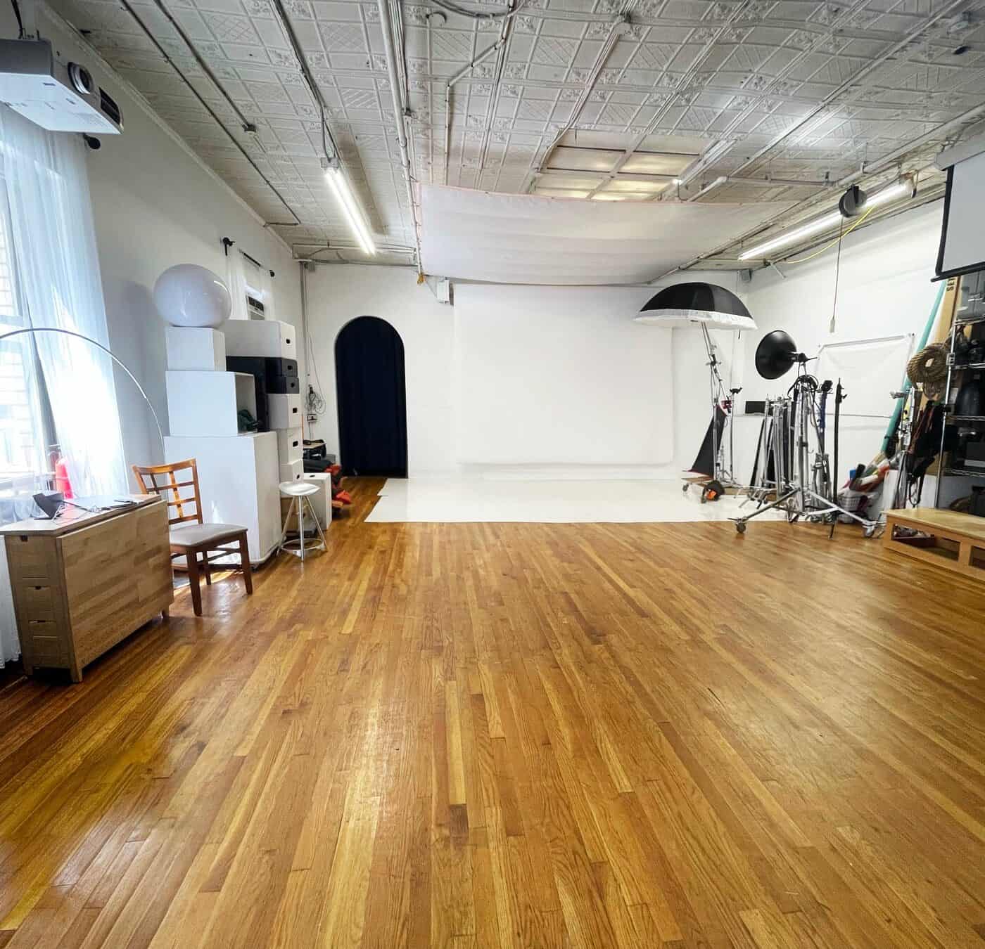 Open Manhattan photo studio rental space with hardwood floors and large shooting area